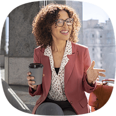 Woman with coffee leaning in to chat